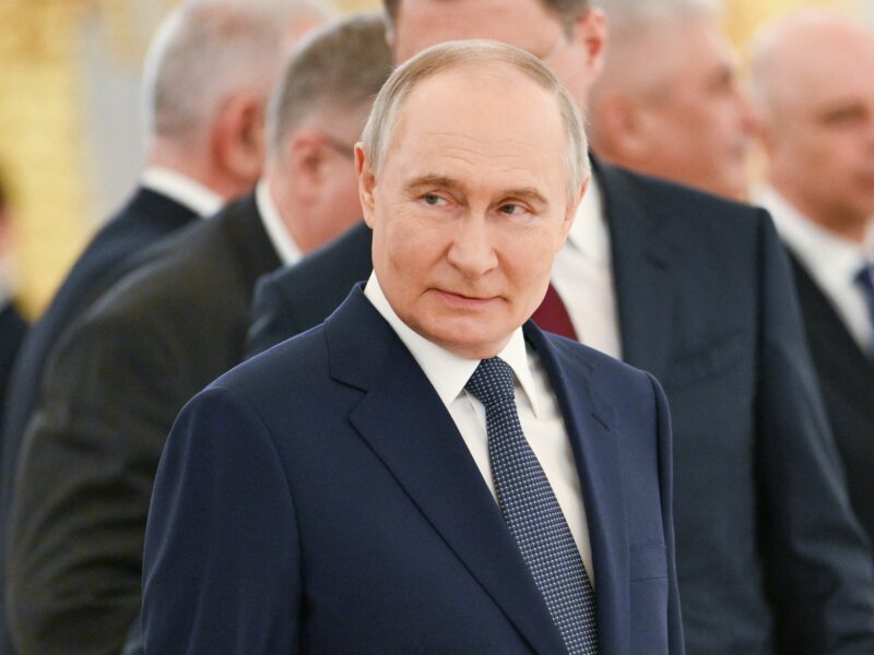 photo of putin in a blue suit