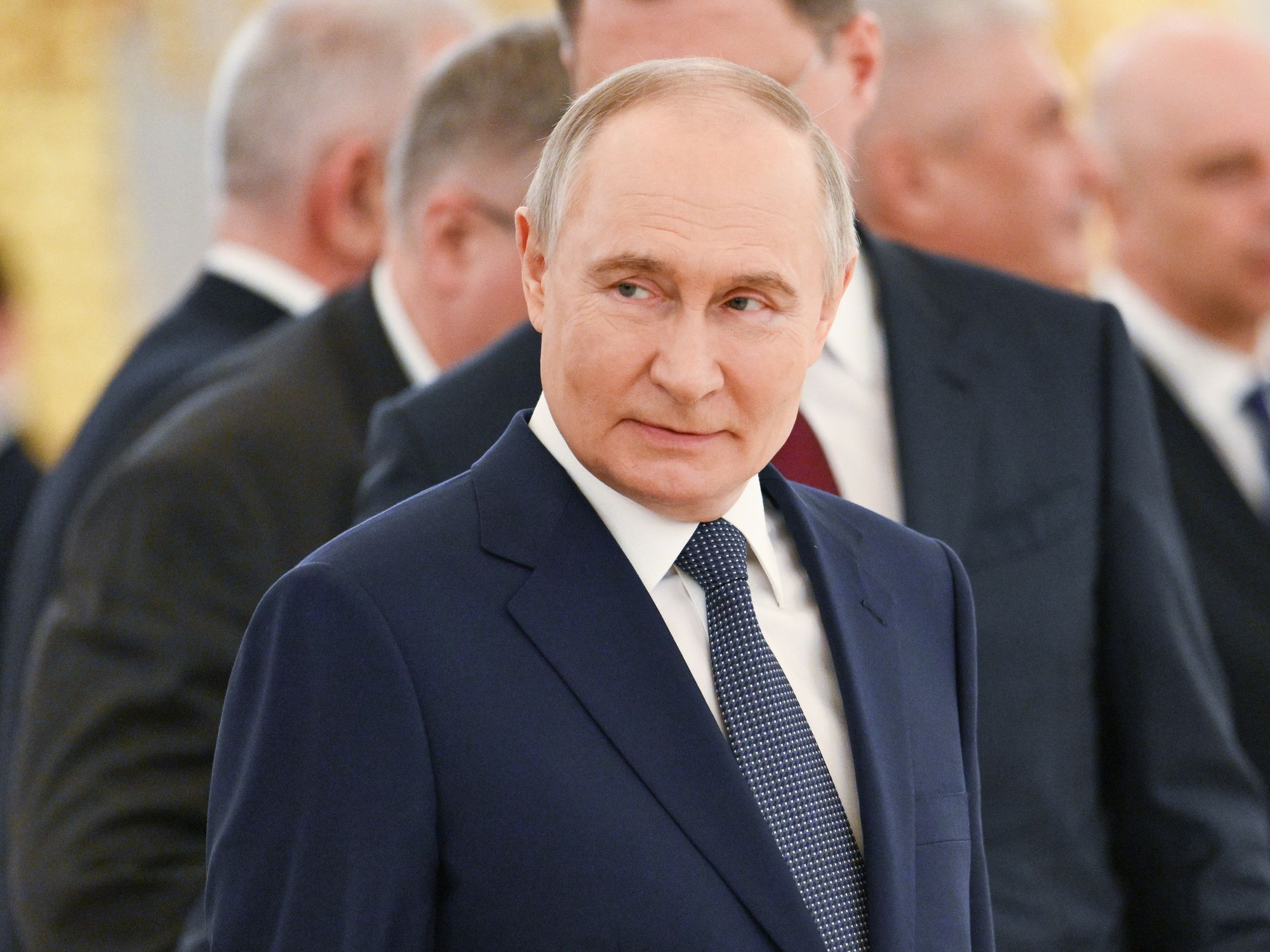 photo of putin in a blue suit