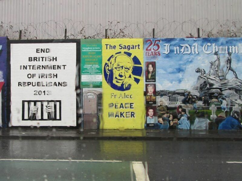 photo of rain and a wall of political signs