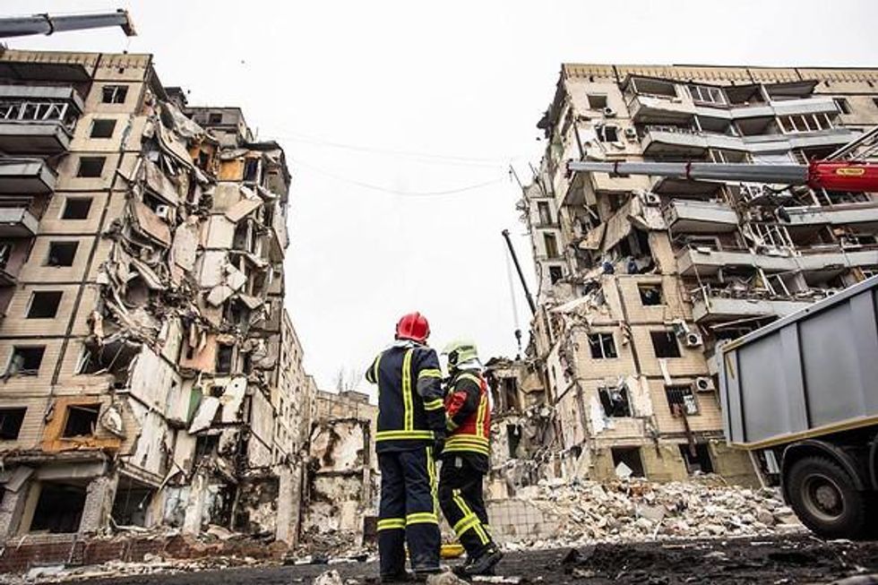 Photo of rescue operations outside a destroyed apartment block in Dnipro, central Ukraine.