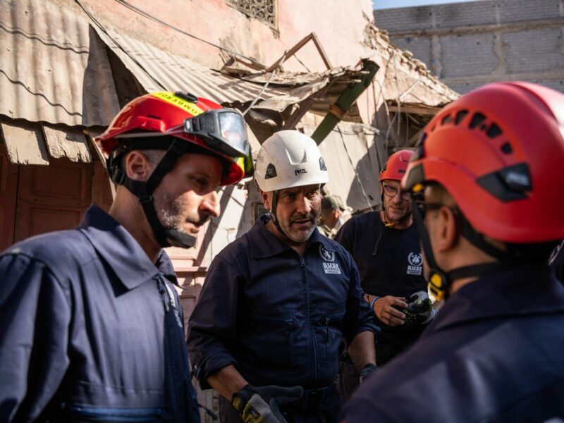 photo of rescue workers discussing the morocco earthquake