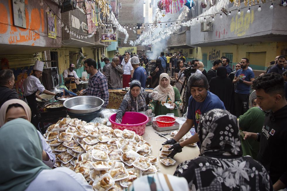 Photo of residents of Cairo sharing iftar meals during Ramadan in Cairo.