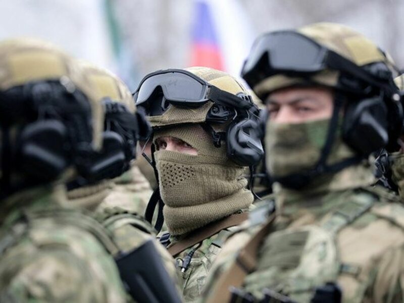 Photo of Russian National Guard officers, with face covered