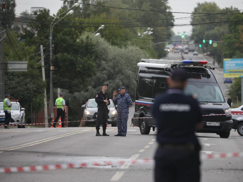 Photo of Russian National officers guarding the scene of a car bombing of journalist Darya Dugina