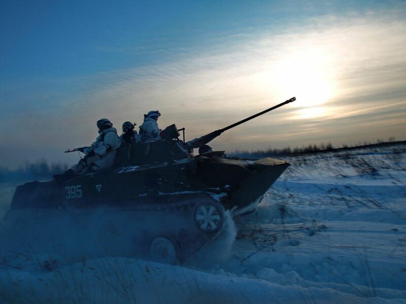Photo of Russian on a tank ploughing through the snow in the Kostroma region of Russia