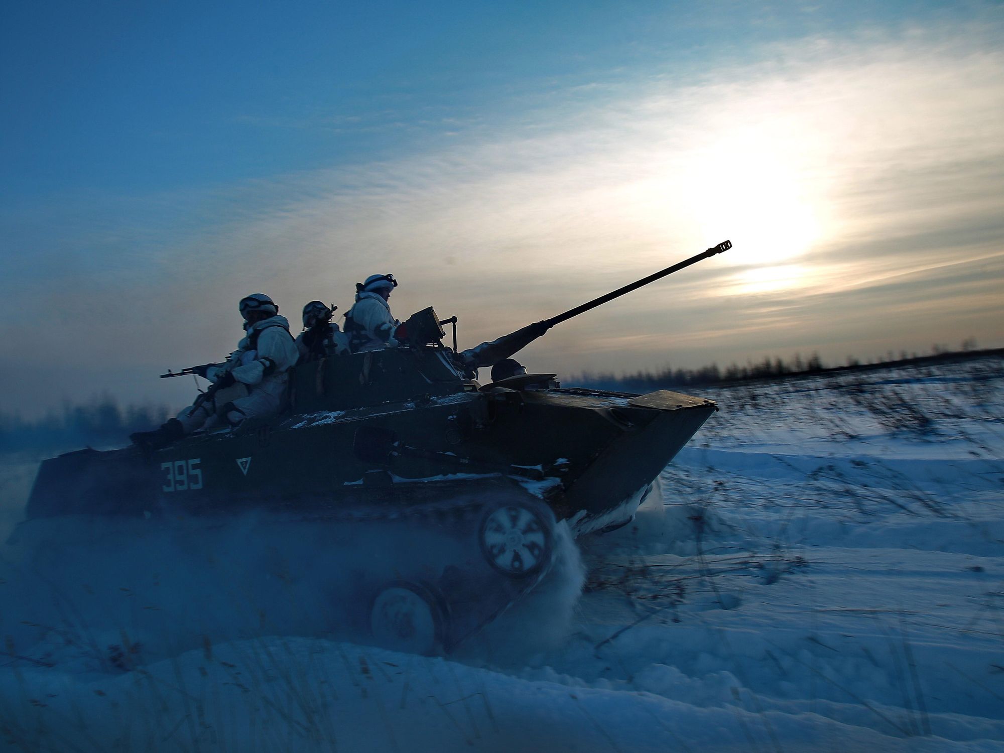 Photo of Russian on a tank ploughing through the snow in the Kostroma region of Russia