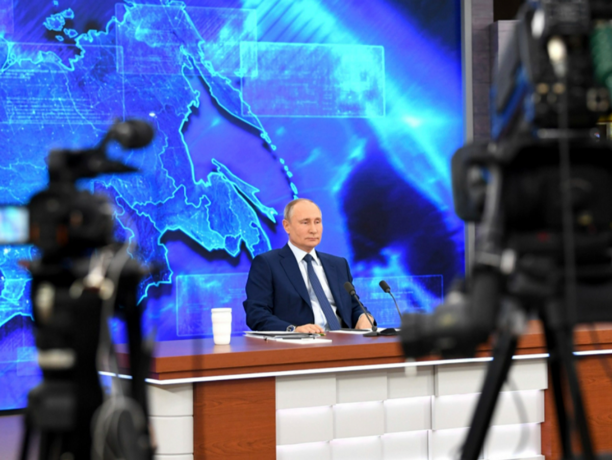 Photo of Russian President Vladimir Putin holding a annual end of year news conference in a pandemic friendly format from his offici