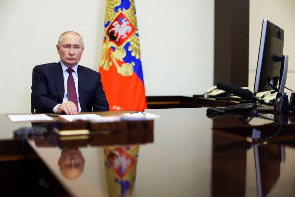 Photo of Russian President Vladimir Putin hosting a meeting via video
