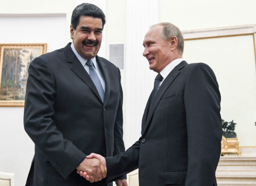 Photo of Russian President Vladimir Putin, right, shaking hands with Venezuela's President Nicolas Maduro during their meeting at the Kremlin in Moscow, Russia, on October 4, 2017.