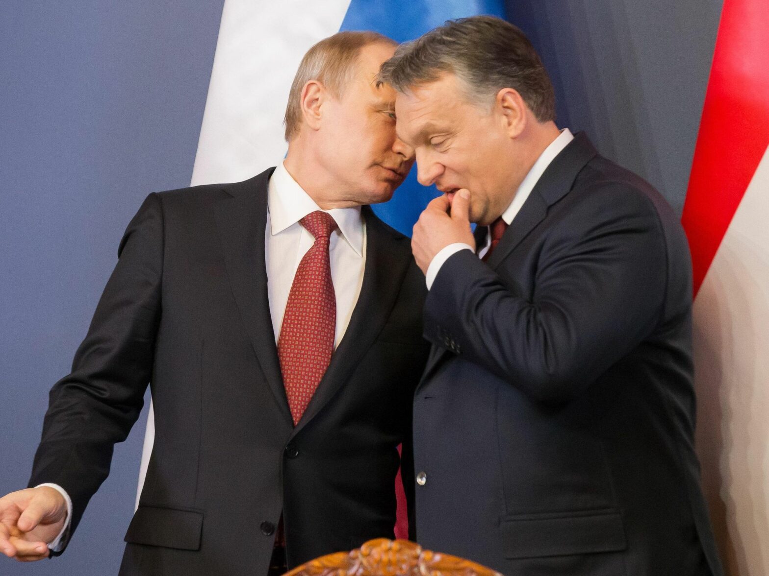 Photo of Russian President Vladimir Putin whispering in Hungarian Prime Minister Viktor Orban during a meeting in Budapest
