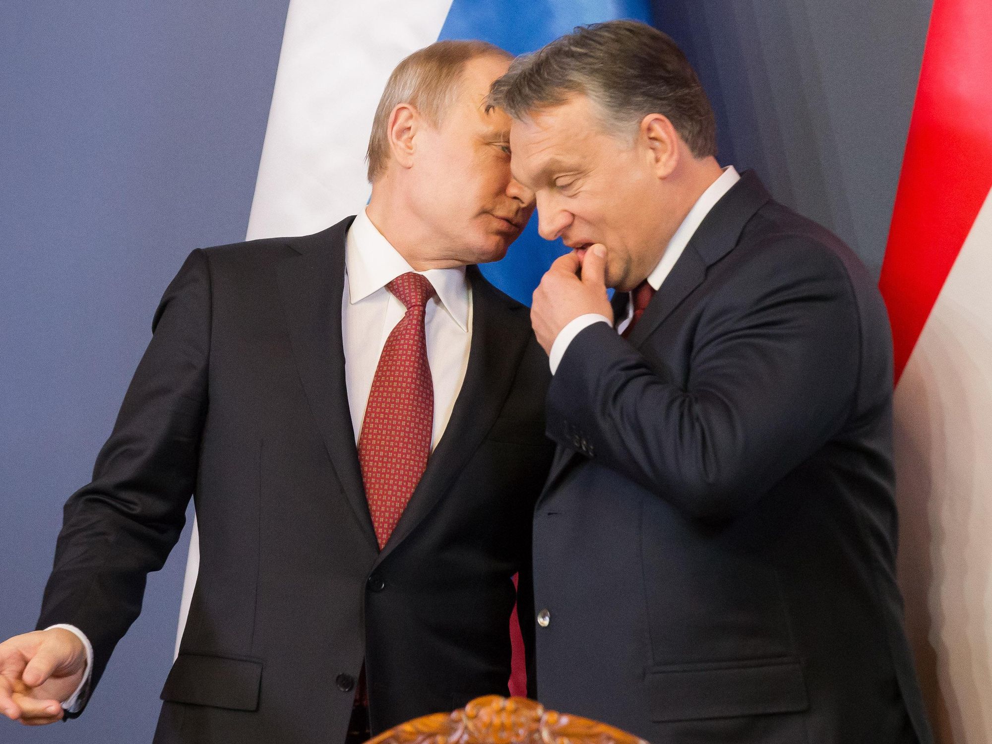 Photo of Russian President Vladimir Putin whispering in Hungarian Prime Minister Viktor Orban during a meeting in Budapest