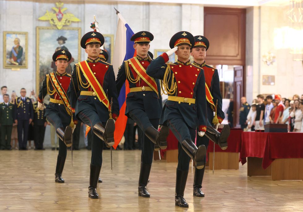 photo of russian soldiers marching in a hall