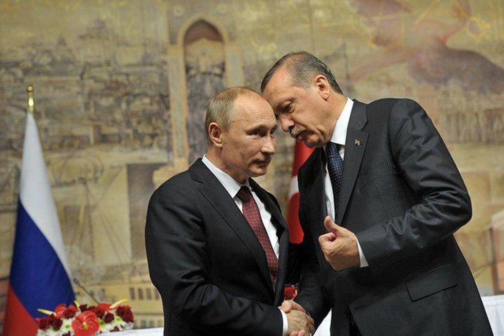 Photo of Russia's Putin and Turkey's Erdogan shaking hands at a meeting