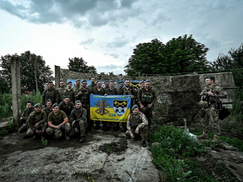 Photo of Servicemen of the 128th separate mountain assault brigade pose for a picture.