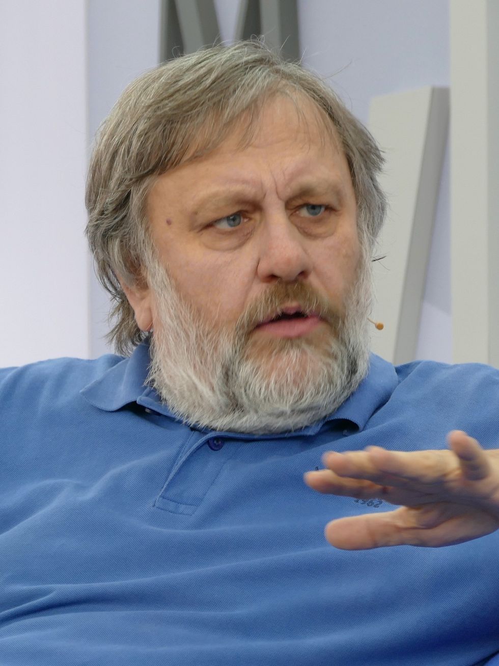 photo of Slavoj Žižek in a blue shirt