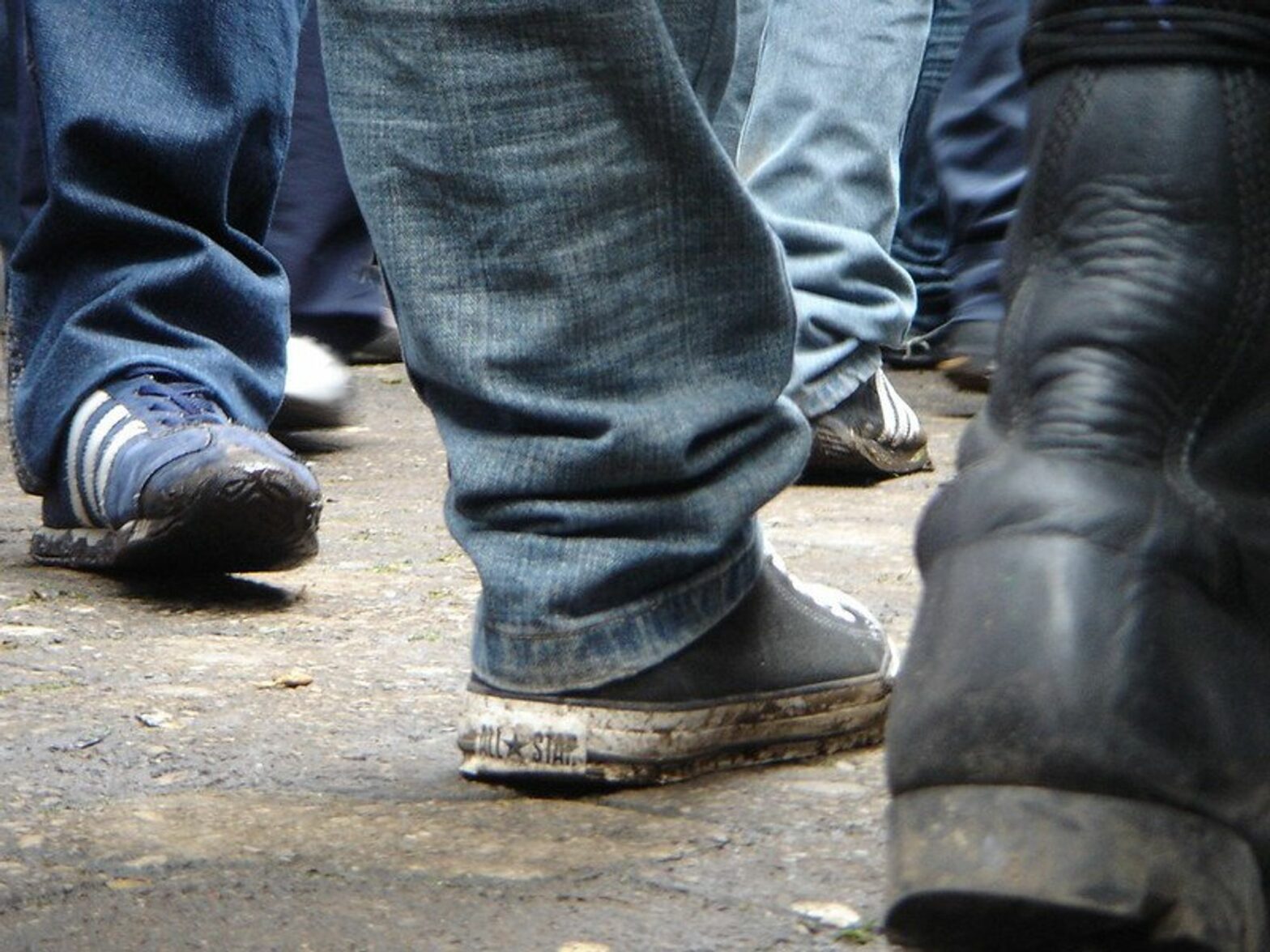 photo of sneakers on the street