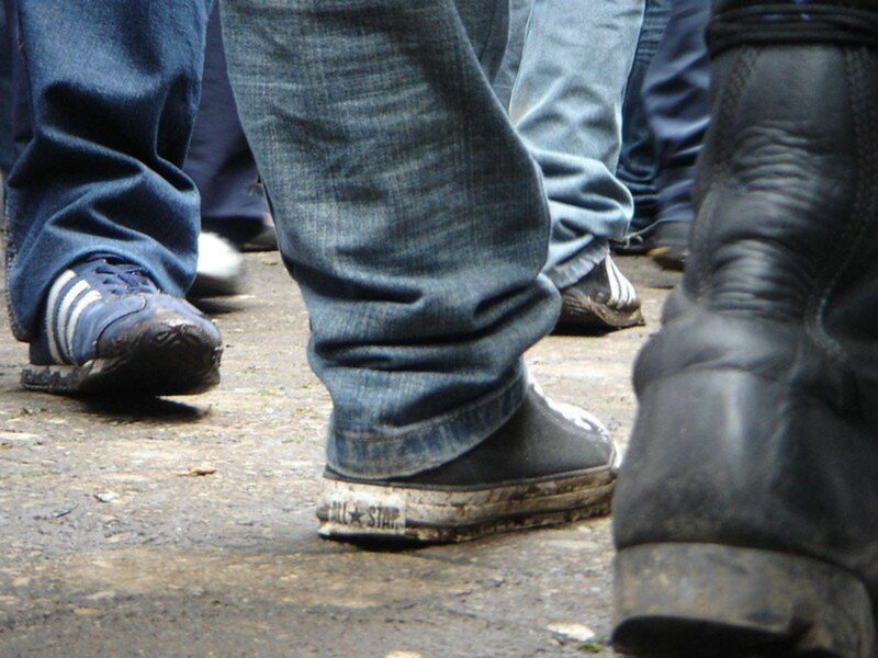 photo of sneakers on the street