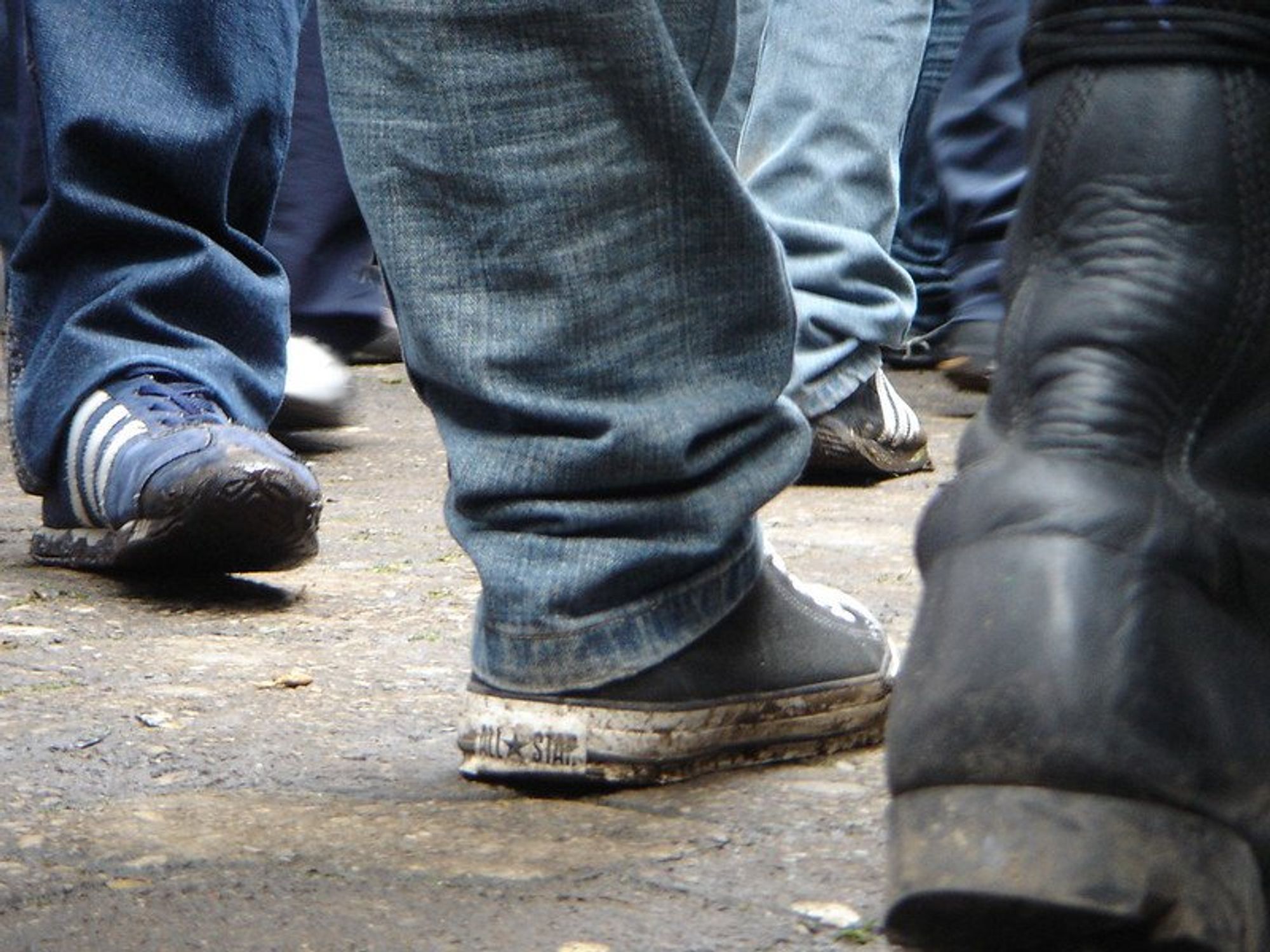 photo of sneakers on the street
