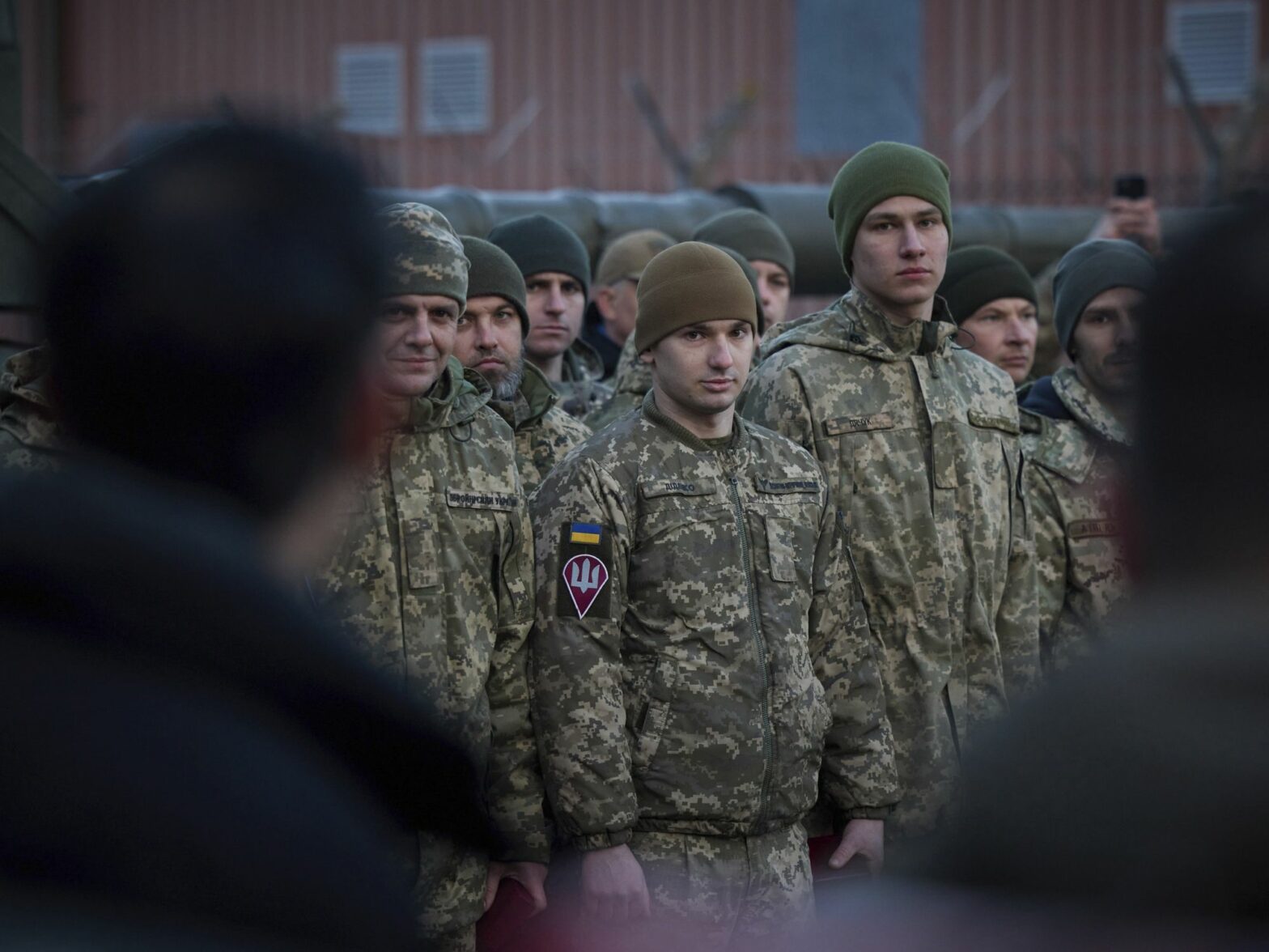 photo of soldiers looking toward the camera