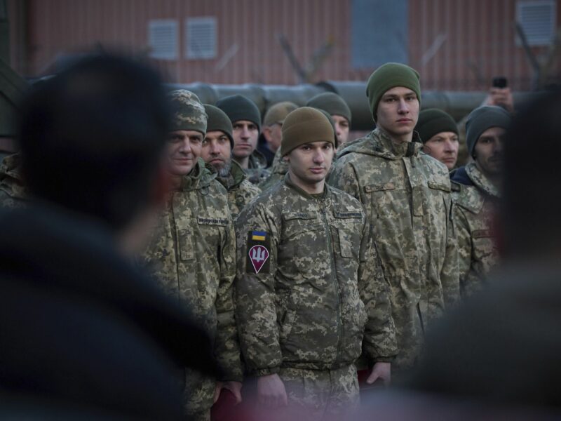 photo of soldiers looking toward the camera