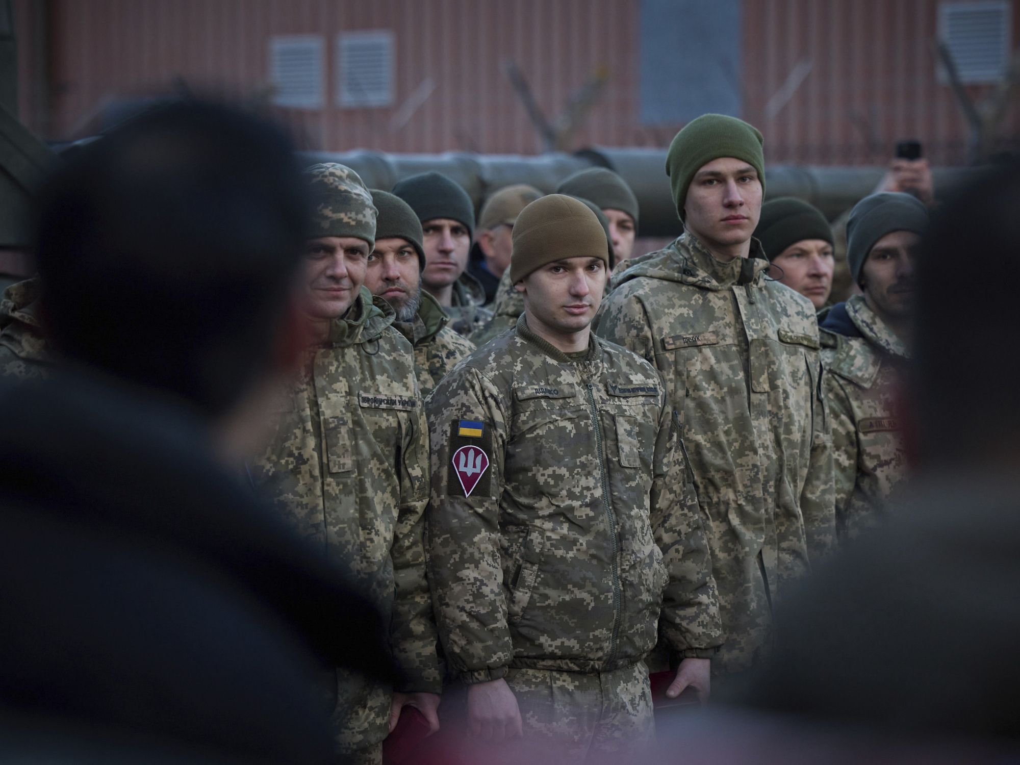 photo of soldiers looking toward the camera