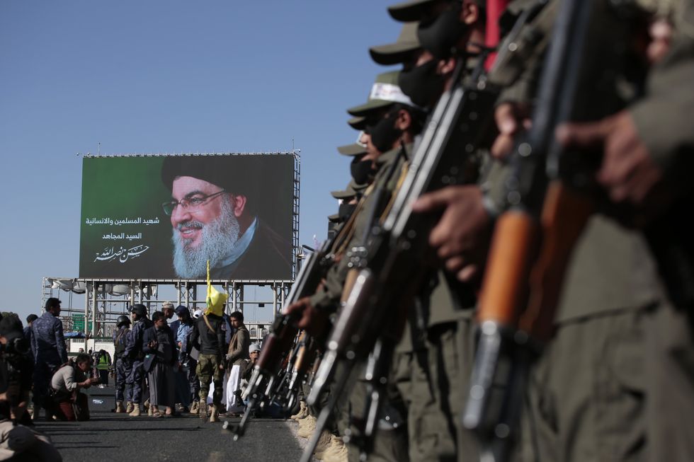 Photo of soldiers wielding rifles during a Houthi demonstration in Sanaa on Oct. 4.
