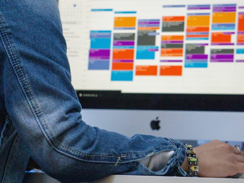 photo of someone at a Mac computer screen