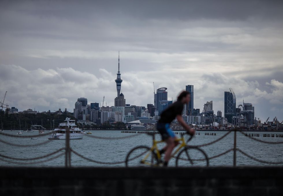 Photo of someone riding a bike at Mission Bay in New Zealand