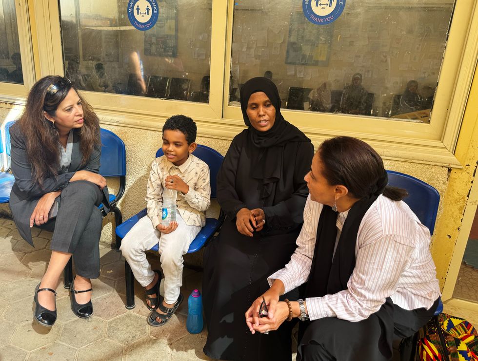 Photo of Sonali Korde, Assistant to the Administrator for the Bureau for Humanitarian Assistance, speaking with refugees during a visit of the UNHCR registration center in Egypt.