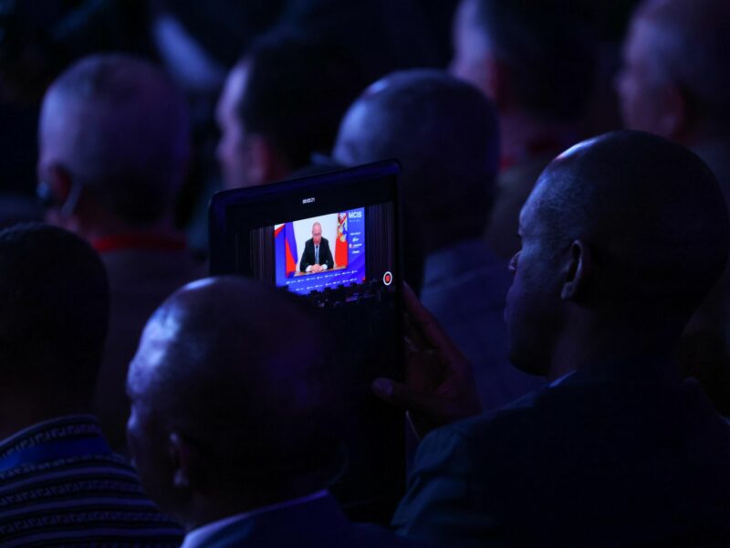 Photo of spectators watching the address by Russia's President Vladimir Putin at the 10th Moscow Conference on International Security