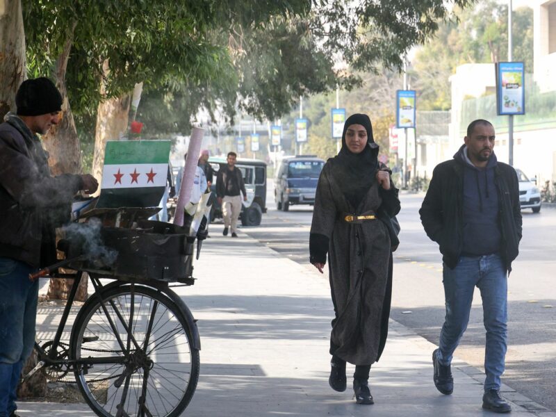 photo of street in damascus, 2 people walking