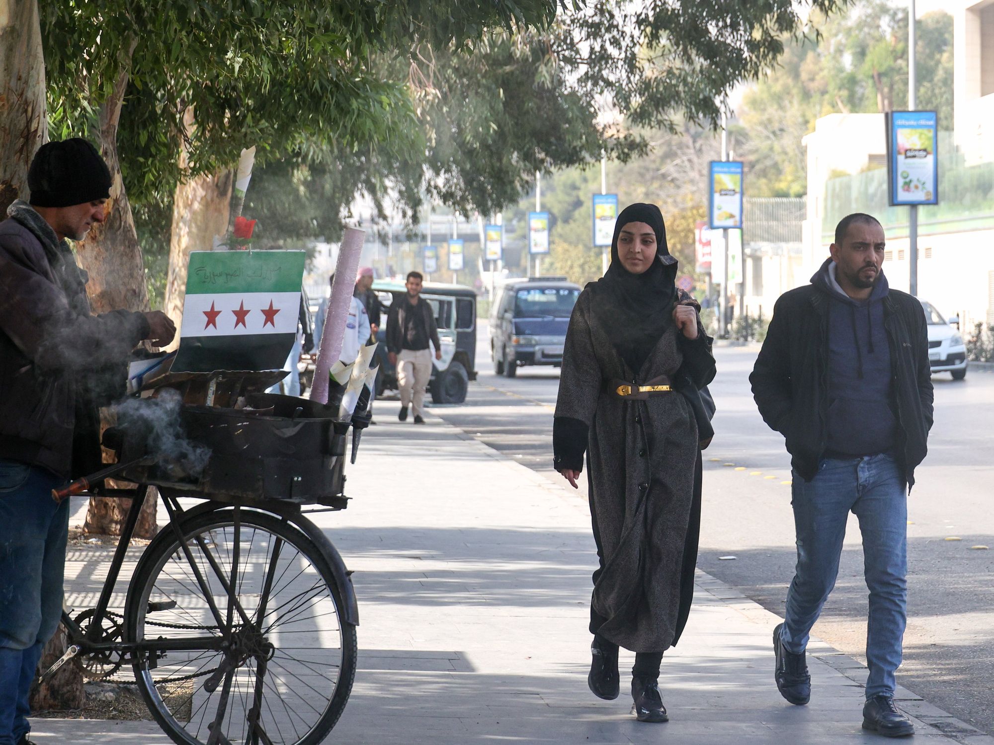 photo of street in damascus, 2 people walking