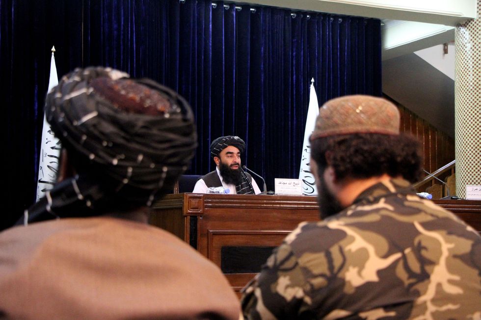 Photo of Taliban spokesman Zabihullah Mujahid speaks during a press briefing in Kabul