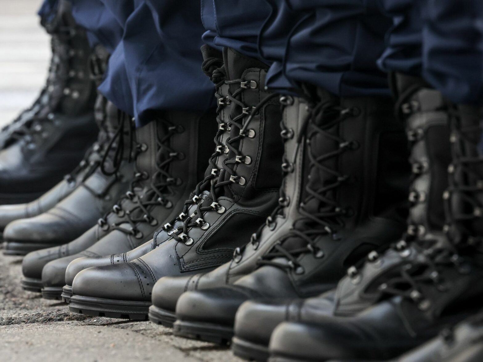 Photo of the boots of the conscripts lining up at an assembly station of St Petersburg's army recruitment office before departing for service with the Russian Armed Forces