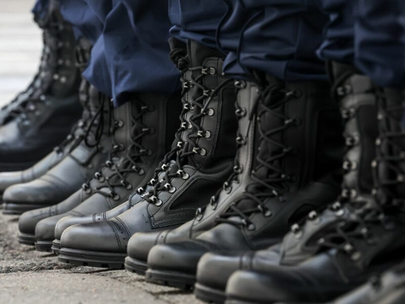 Photo of the boots of the conscripts lining up at an assembly station of St Petersburg's army recruitment office before departing for service with the Russian Armed Forces