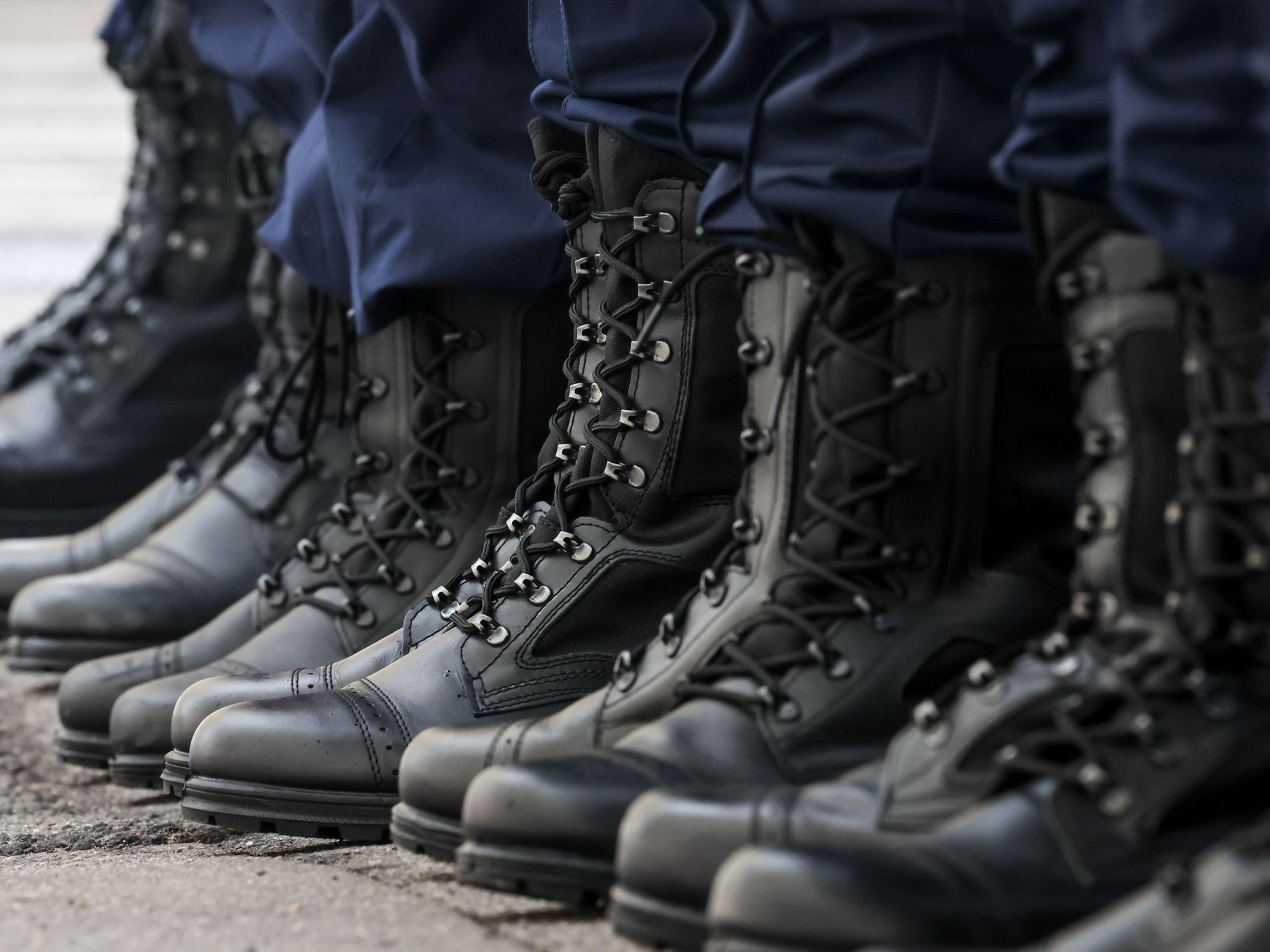 Photo of the boots of the conscripts lining up at an assembly station of St Petersburg's army recruitment office before departing for service with the Russian Armed Forces