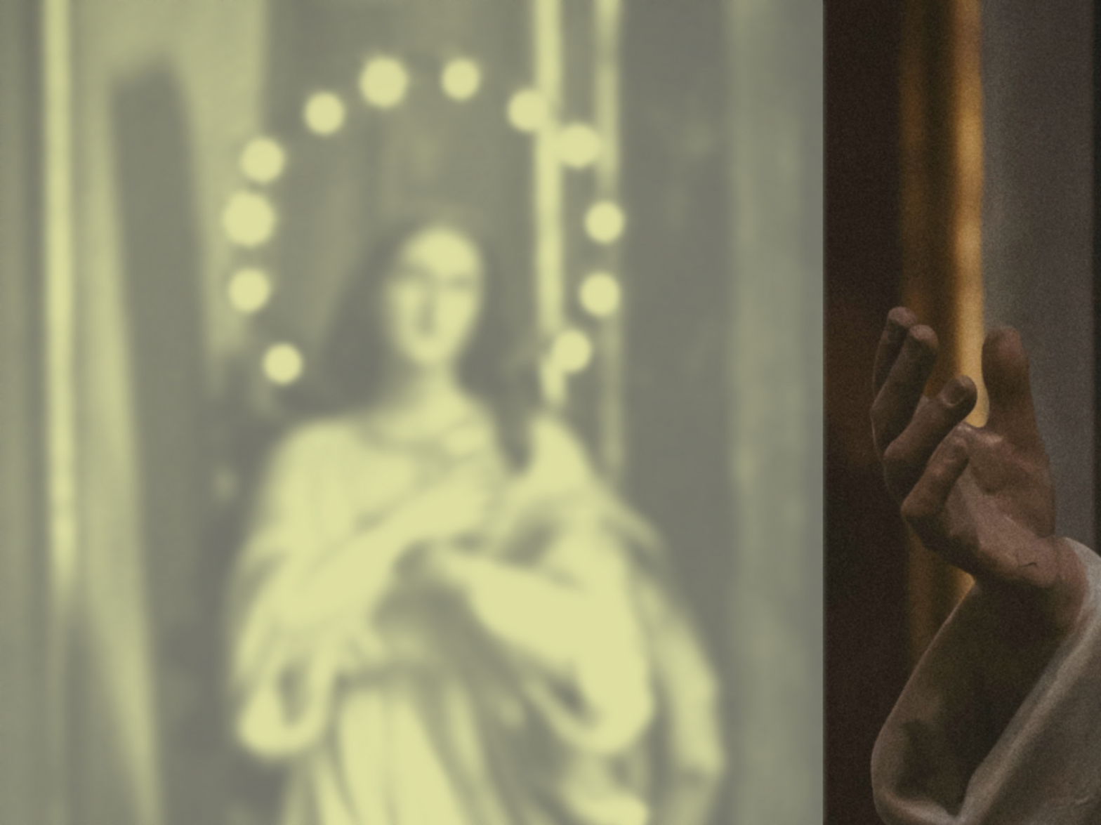 Photo of the hand of a statue and a statue of an angel inside a Naples church