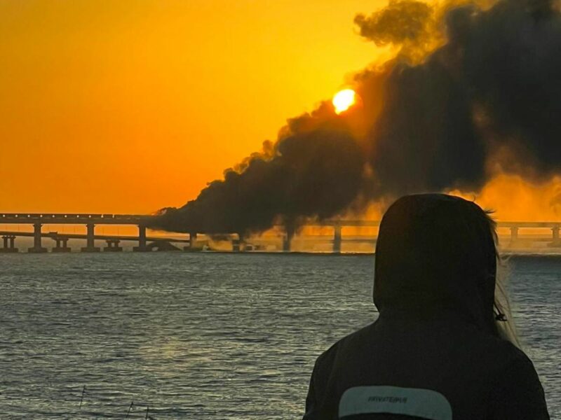 Photo of the sun setting through the smoke caused by the the fire on the bridge linking Crimea to mainland Russia following an explosion on Oct. 8