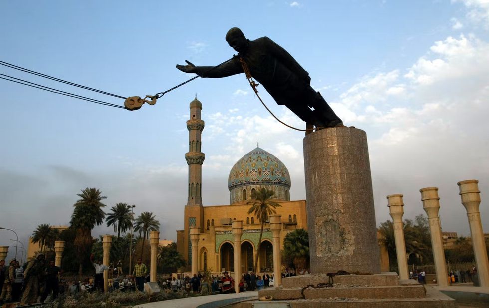 Photo of the toppling of Saddam Hussein’s statue after the invasion of Iraq in 2003.