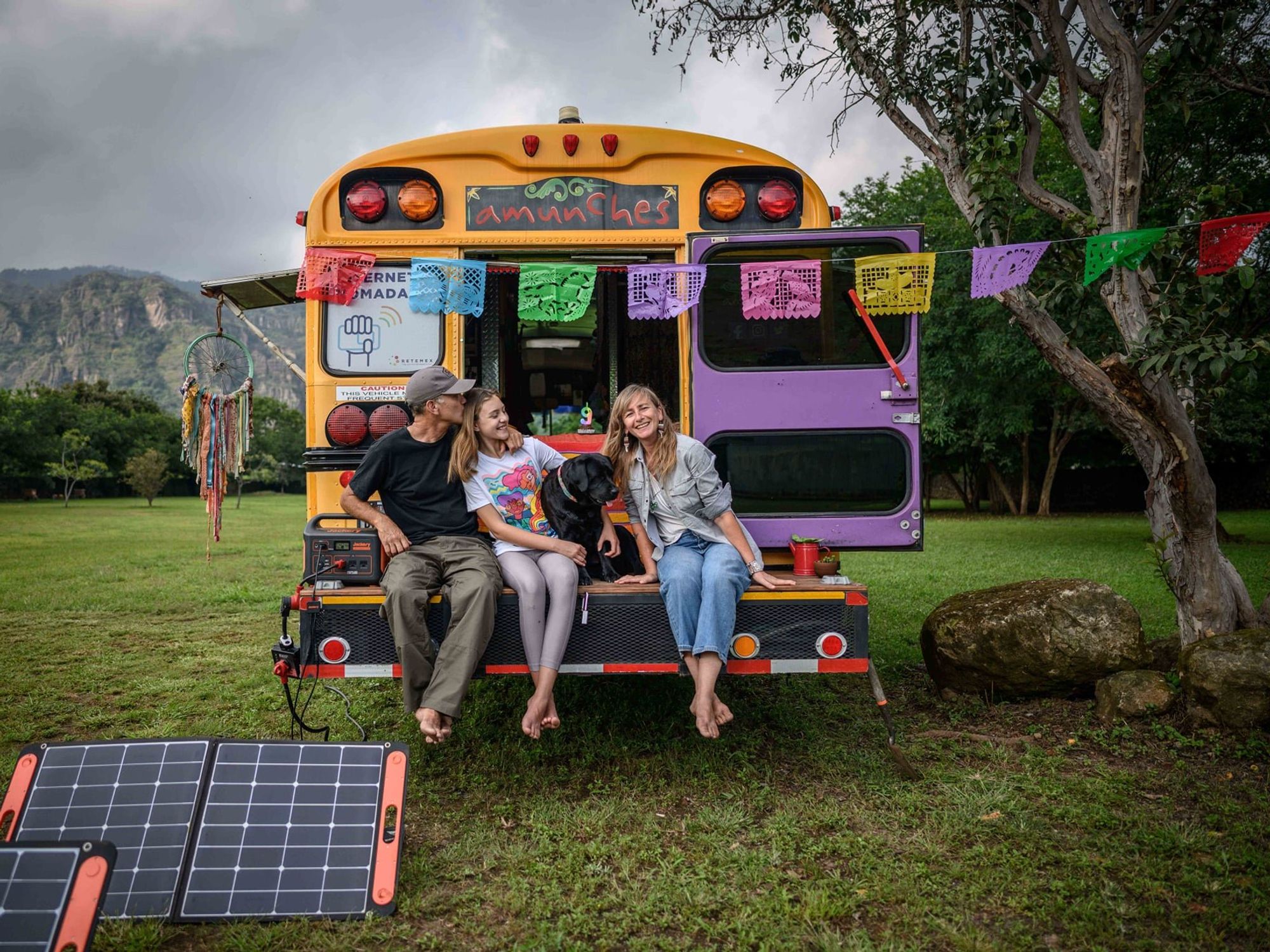 Photo of the traveling family sitting on the back of the minibus in Tepoztlan, Mexico
