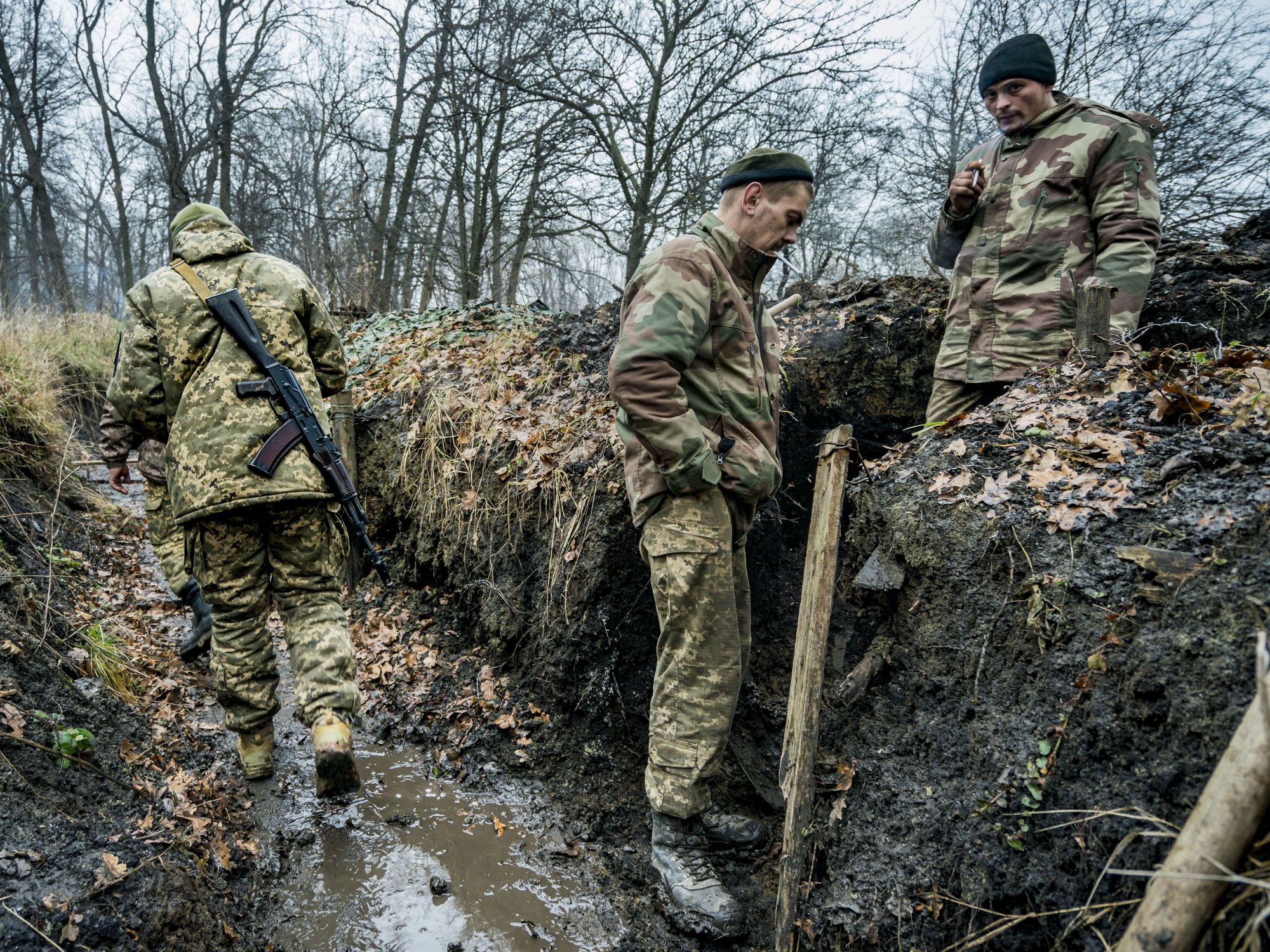 Photo of three ​Ukrainian soldiers in trenches near Bakhmut, Ukraine