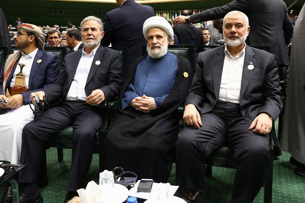 photo of three men sitting down