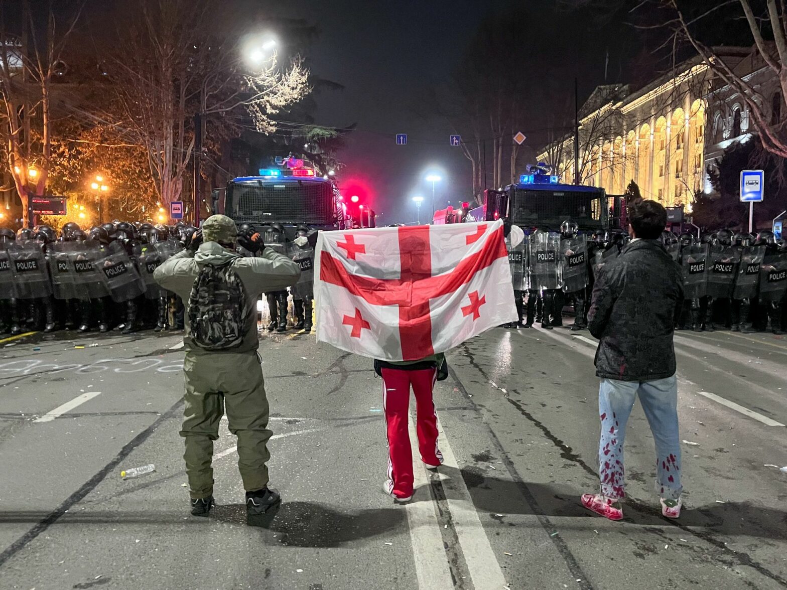 Photo of three protesters against the Foreign Agent Law in Tbilisi, Georgia, in March 2023.