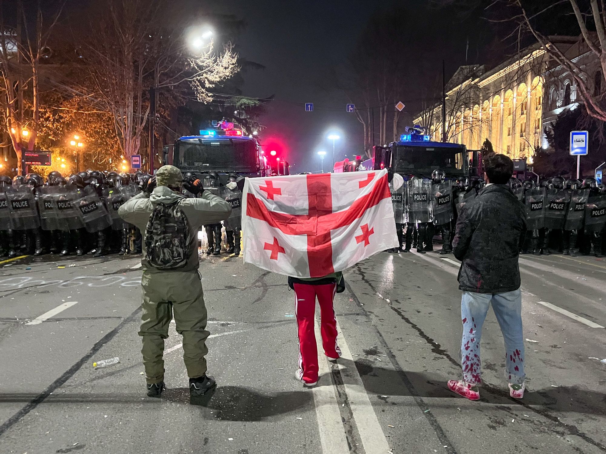 Photo of three protesters against the Foreign Agent Law in Tbilisi, Georgia, in March 2023.