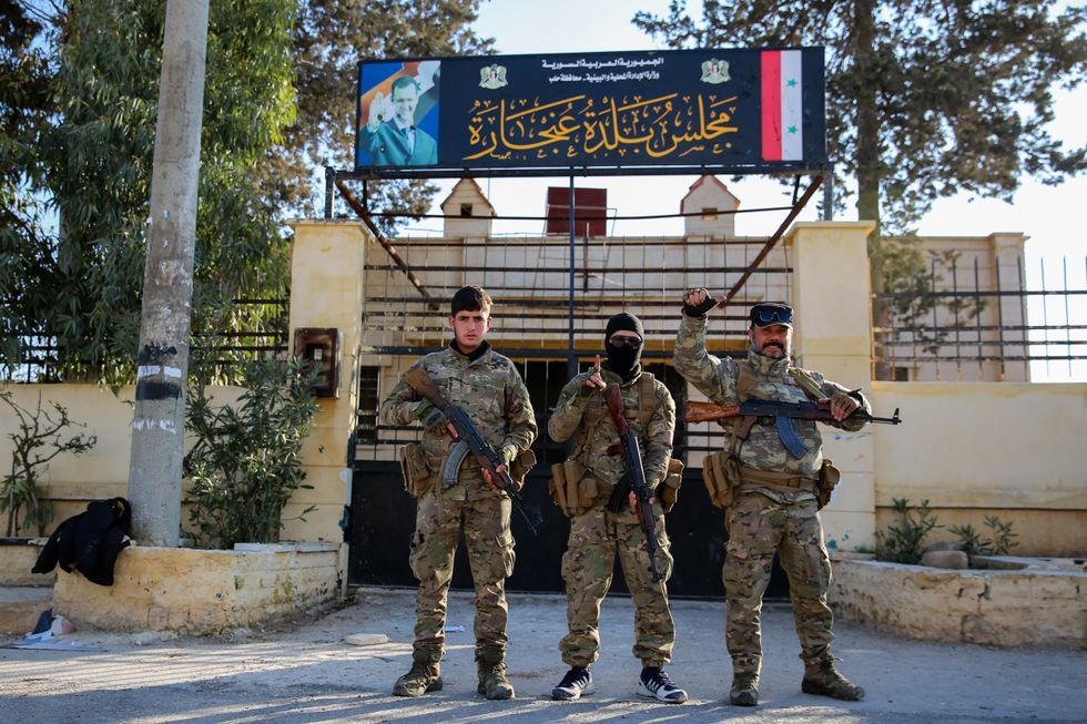 photo of three syrian rebel fighters