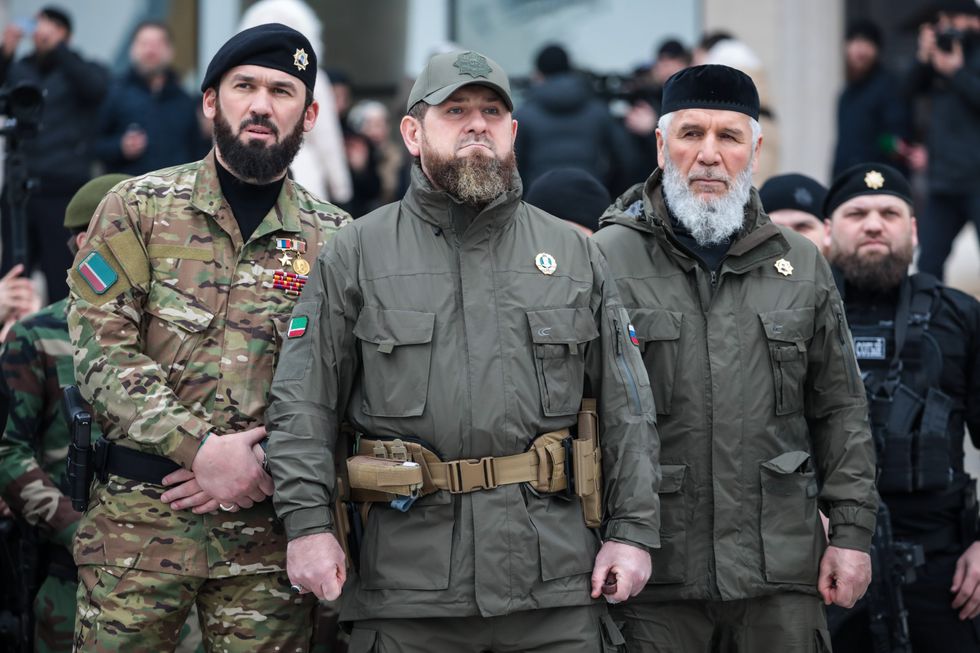 photo of three uniformed men