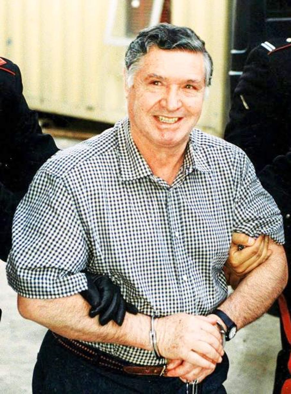 Photo of Totò Riina being arrested in 1993