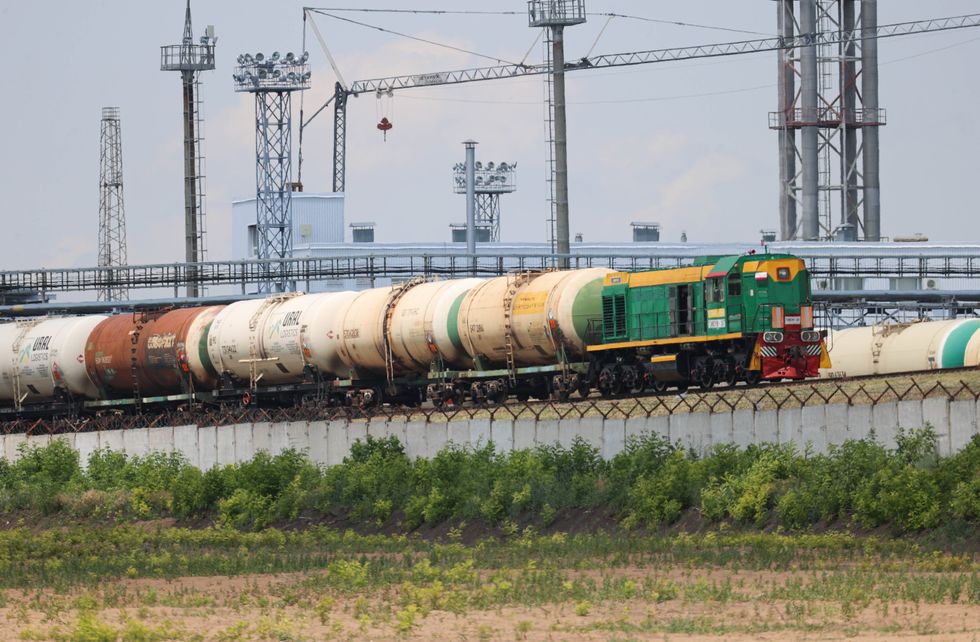 photo of trains at oil refinery