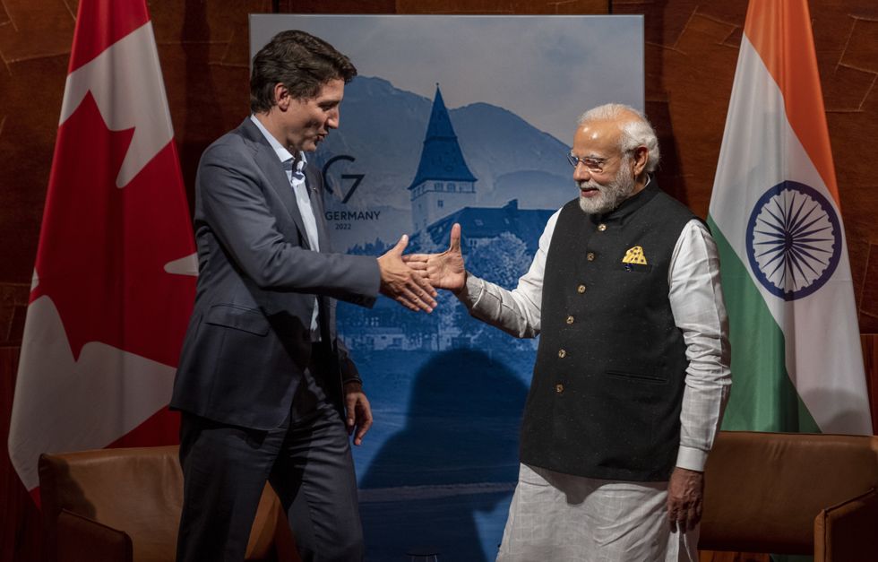 photo of trudeau and modi shaking hands