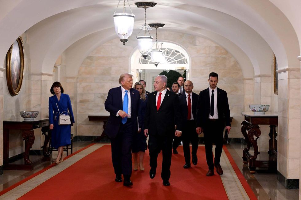 photo of trump and netanyahu walking